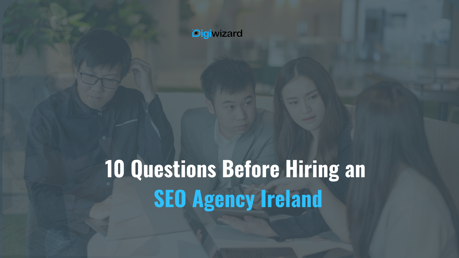 Irish business owner asking questions to an SEO agency consultant in a Dublin meeting room
